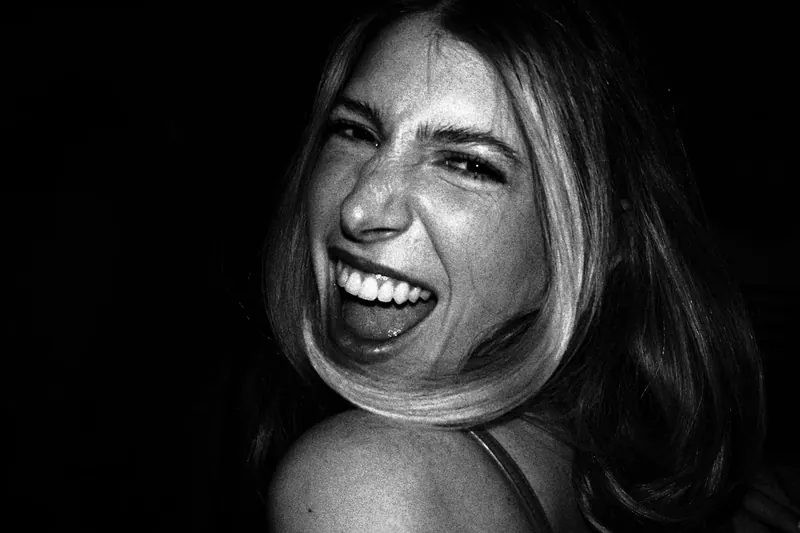 Woman smiling and showing teeth