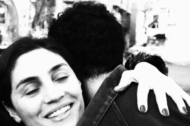 Woman hugging man