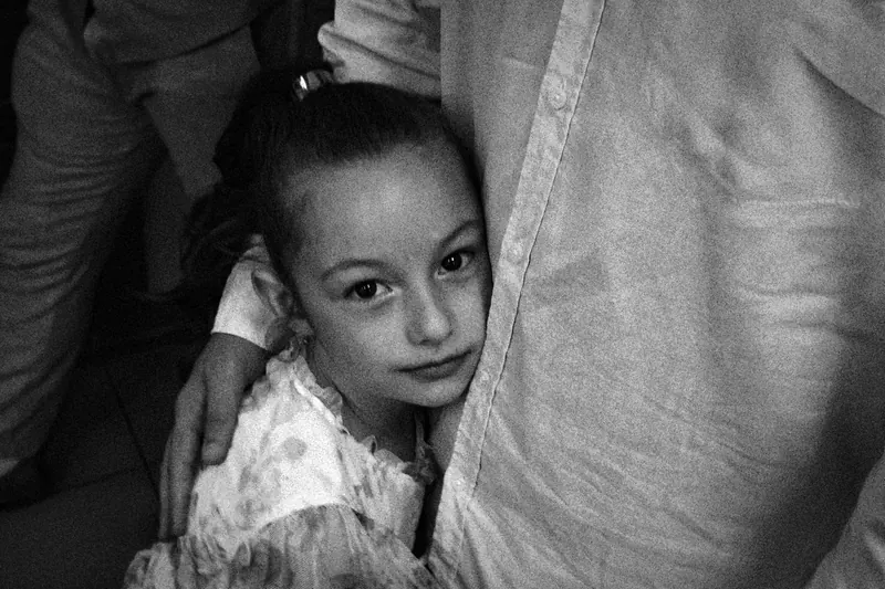 girl holding father