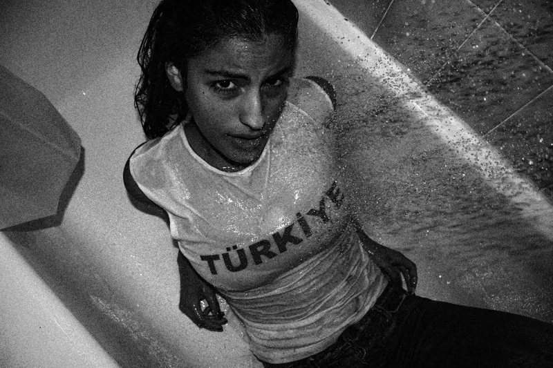 Women in shower with clothes